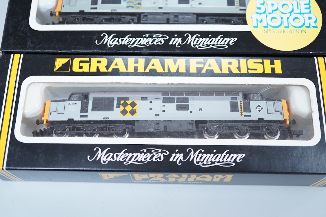 Four boxed Graham Farish N gauge railway Class 37 diesel locomotives; a BR, 37 408 (8035), a BR Coal Sector, 37696 (8036), a BR Petroleum Sector, 37 887 (8037) and a BR Railfreight Metals, 37 906 (8038).